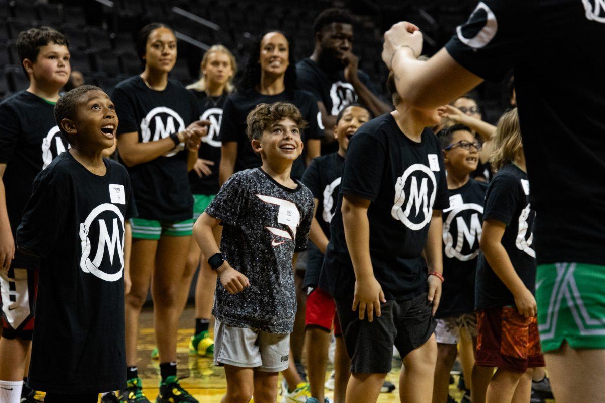 A group of awe-struck kids can't believe their eyes as their leaders sink one three-pointer after another, filling them with pure joy and inspiration. University of Oregon&#8217;s men's and women's basketball teams host a basketball clinic in partnership with the Mamba and Mambacita Sports Foundation at Matthew Knight Arena in Eugene, Ore., on Sunday, October 8th. (Sebastian Flores/Emerald)