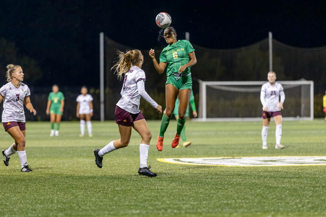 Grace Mensah (6) jumps in the air to head the ball, and start an offensive play. The University of Oregon Ducks soccer team lost to the Arizona State Sun Devils 0-2 at Pape Field in Eugene, Ore., on Oct. 14, 2023. (Kemper Flood/ Emerald)