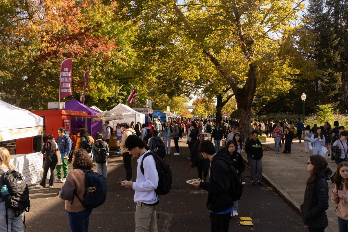 Amid the excitement of the ASUO Fall Street Fair, students patiently queue up at the numerous food stands. ASUO (The Associated Students of the University of Oregon) held their annual Fall Street Faire on 13th St. in Eugene, Ore., from Oct. 11-13. (Sebastian Flores/Emerald)