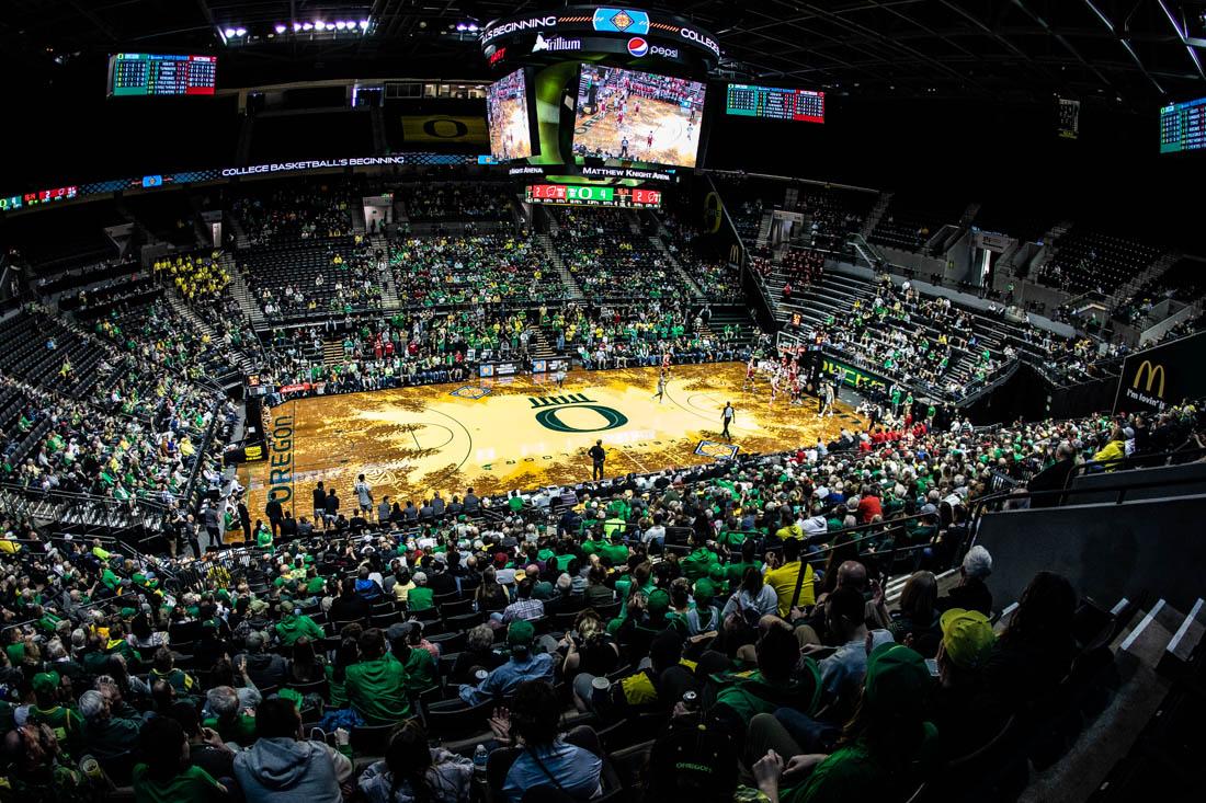 The crowd at Matthew Knight Arena varies from Ducks to Badgers fans for the third round of NIT. University of Oregon Mens Basketball take on the Wisconsin Badgers in round 3 of the National Invitational Tournament at Matthew Knight Arena in Eugene, Ore., on Mar. 21, 2023. (Maddie Stellingwerf/Emerald).