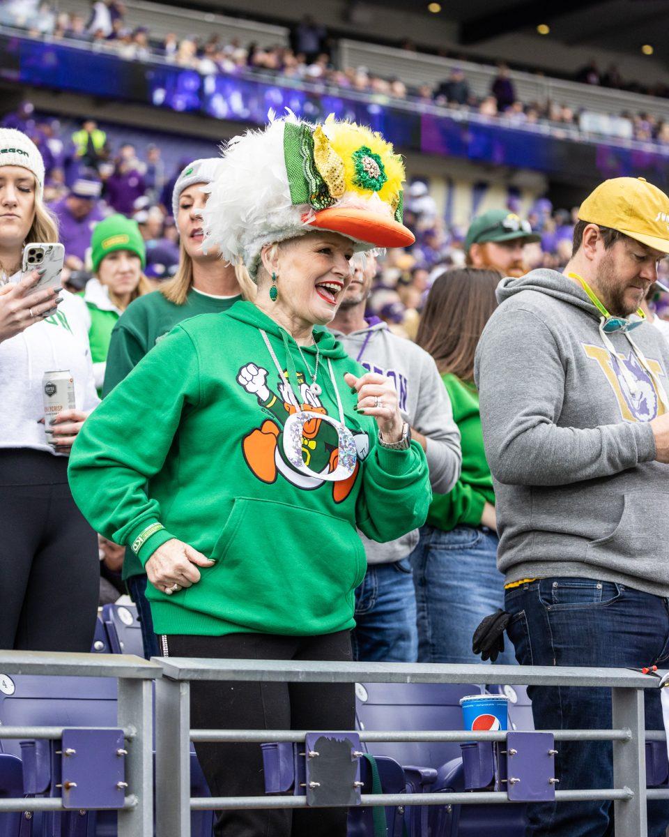 Iconic Oregon Football fan "Mimi" dances along to the Oregon Marching Band as they perform the fight song.&#160;The University of Oregon Ducks Football team were defeated by the University of Washington Huskies in an away match at Husky Stadium in Seattle, Washington, on October 14, 2023. (Jonathan Suni/Emerald)