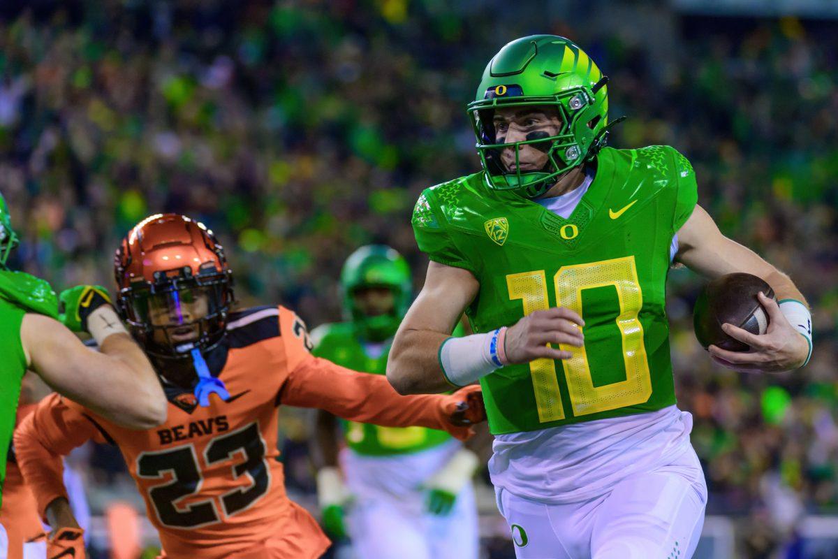 Oregon's Bo Nix (10) runs for a touchdown. The University of Oregon Ducks Football team defeated Oregon State University 31-7 in a home match at Autzen Stadium in Eugene, Ore., on Nov. 24, 2023. (Eric Becker/Emerald)