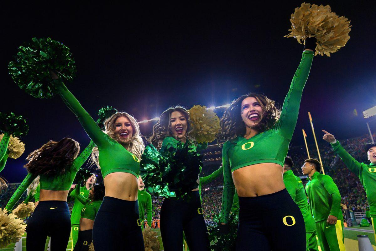 Oregon Cheerleaders dance during the singing of "Shout" between the 3rd and 4th quarter. The University of Oregon Ducks Football team defeated Oregon State University 31-7 in a home match at Autzen Stadium in Eugene, Ore., on Nov. 24, 2023. (Eric Becker/Emerald)