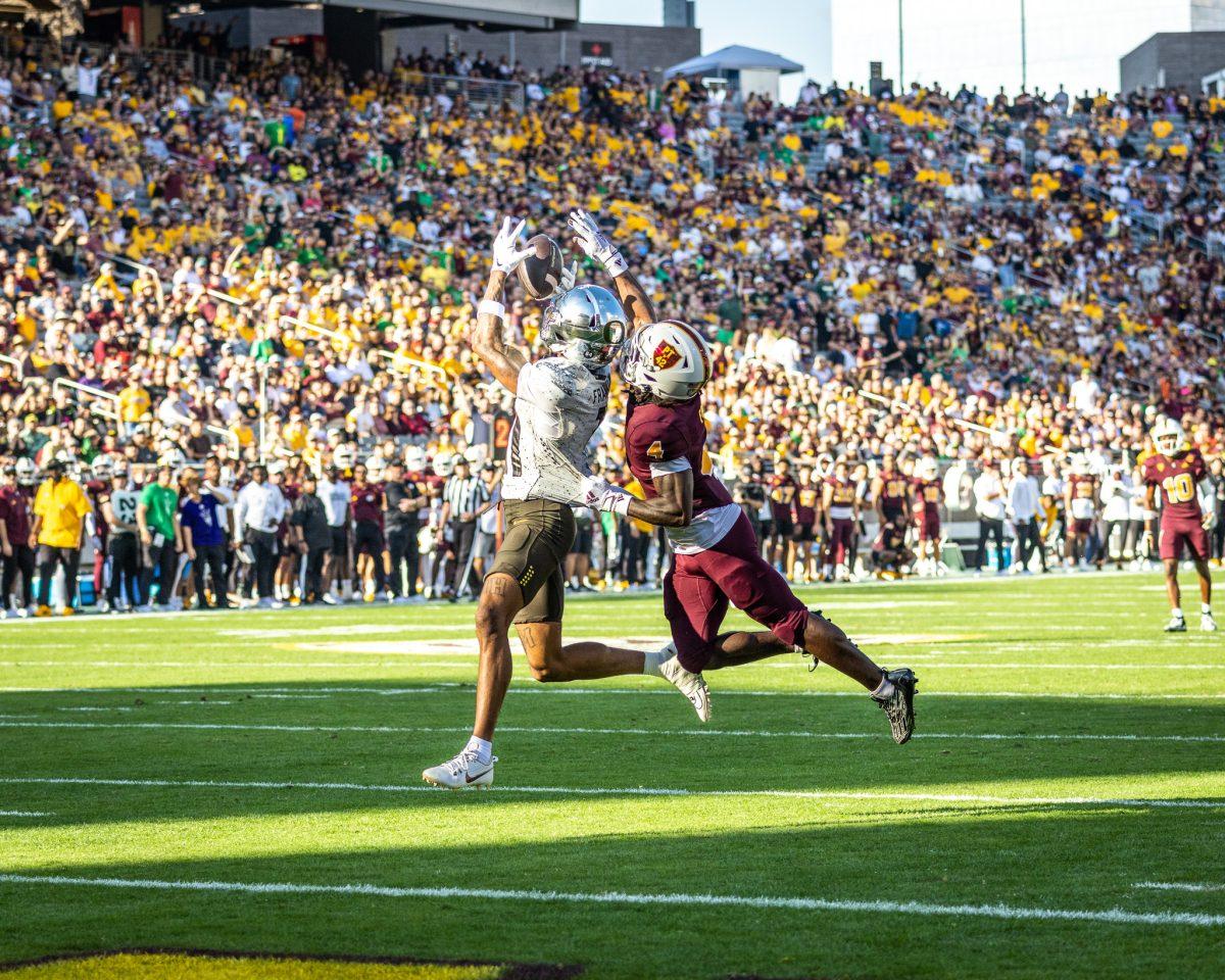 Troy Franklin (11) responds to his first quarter touchdown with another impressive 45 yard touchdown in the second quarter that leaves a mark in the Oregon Football record books. The Oregon Ducks crush the Arizona State Sun Devils at Mountain America Stadium in Tempe, Ariz., on Nov. 18, 2023. (Jonathan Suni/Emerald)&#160;