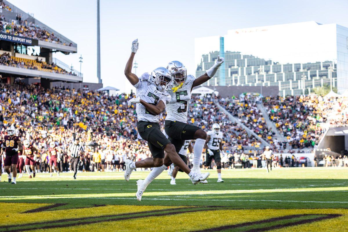 Oregon transfer wide receivers, Gary Bryant Jr. (2) and Traeshon Holden (5), celebrate a 71 yard touchdown by Bryant. The Oregon Ducks crush the Arizona State Sun Devils at Mountain America Stadium in Tempe, Ariz., on Nov. 18, 2023. (Jonathan Suni/Emerald)