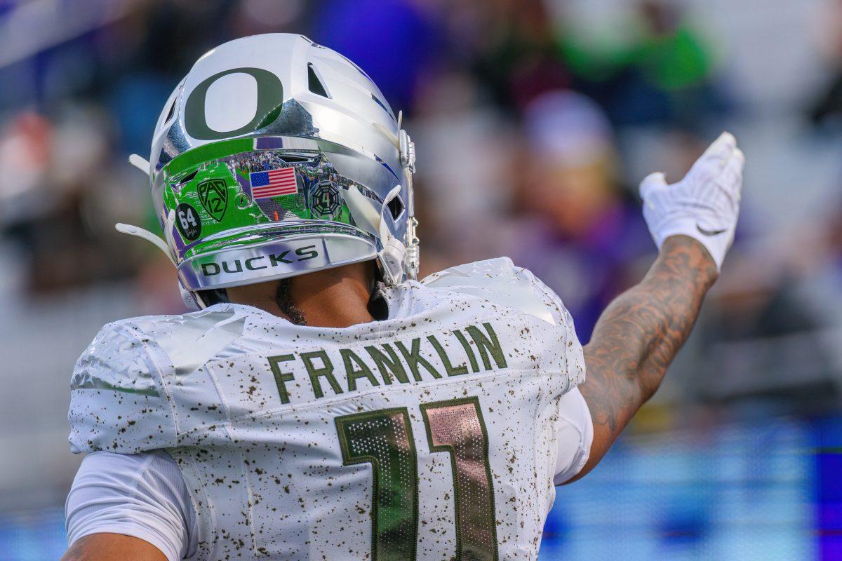 Troy Franklin (11) points towards the crowd. The University of Oregon Ducks Football team were defeated by the University of Washington Huskies in an away match at Husky Stadium in Seattle, Washington, on October 14, 2023. (Eric Becker/Emerald)