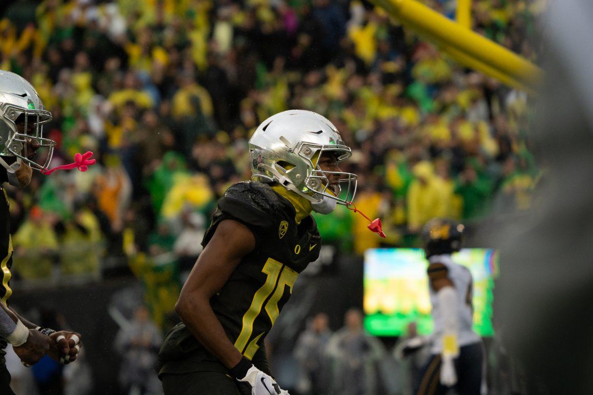 Ducks wide receiver Tez Johnson (15) celebrates as he runs into the endzone, giving the Ducks a bigger lead. The Oregon Ducks defeat the California Golden Bears 63-19 at Autzen Stadium in Eugene Ore., on Nov. 4, 2023. (Sebastian Flores/Emerald)