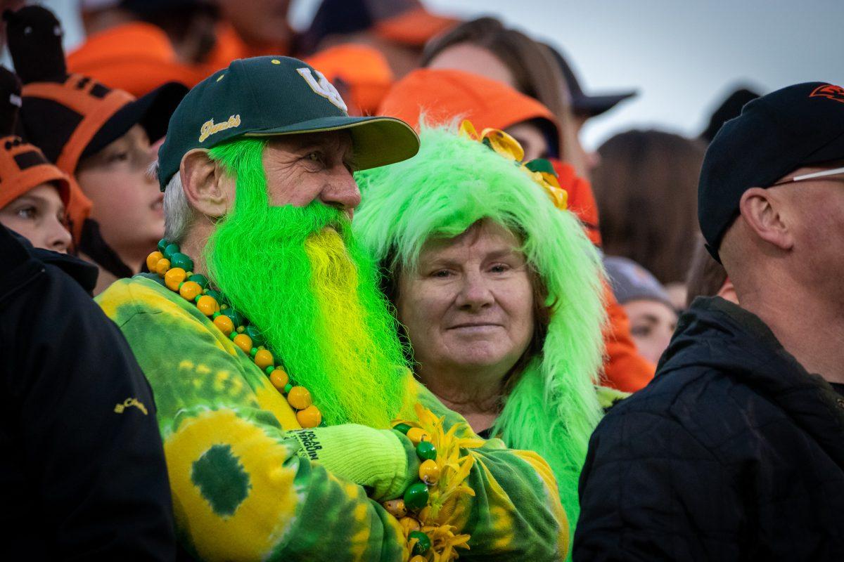 Two disappointed Duck fans surrounded by Beaver fans wait as the final seconds of the game pass.&#160;The Oregon Ducks travel up to Corvallis to face their in-state rival the Oregon State Beavers on November 26th, 2022, for their last game of the regular season.&#160;(Jonathan Suni, Emerald)