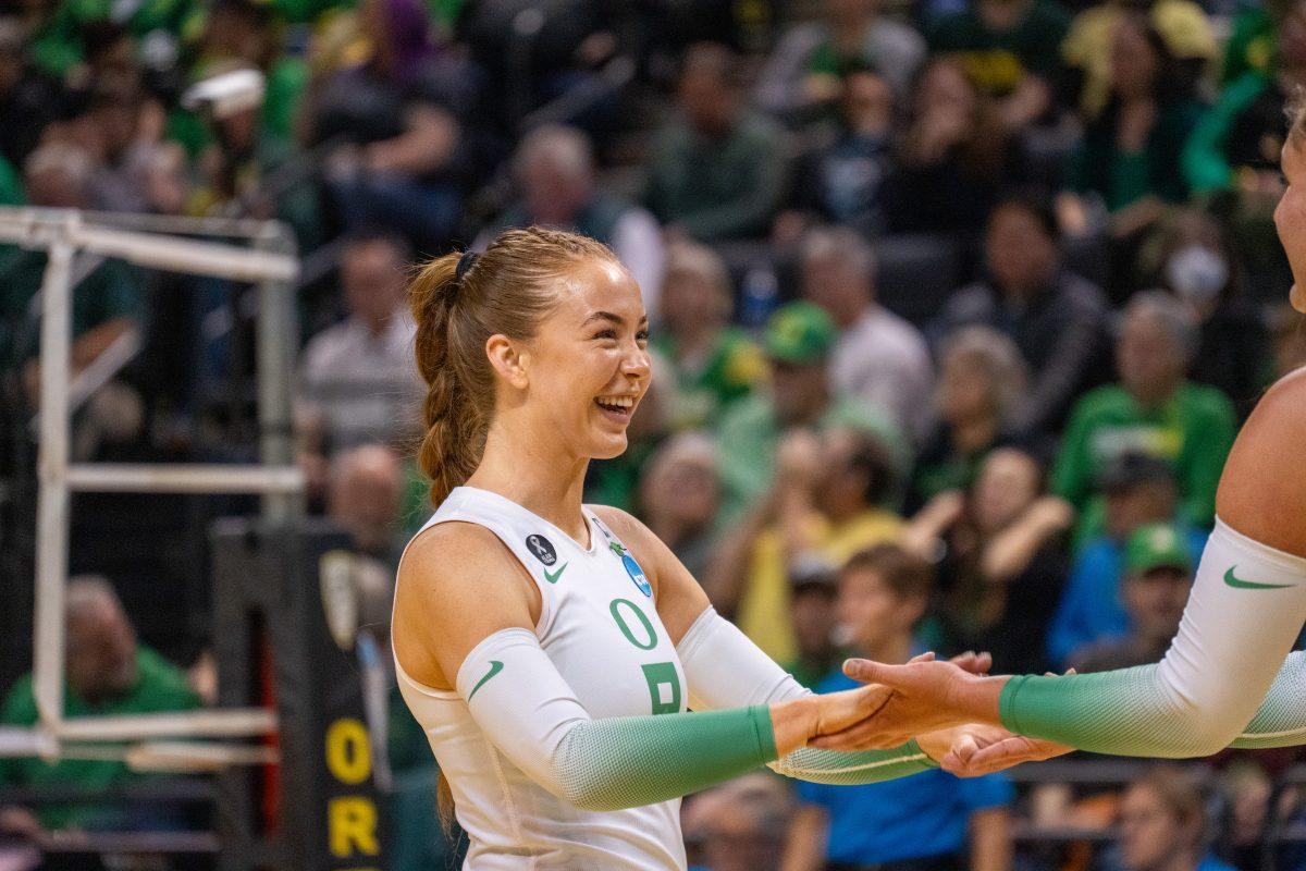 Hannah Pukis (9) smiling. The University of Oregon Ducks Volleyball team played the University of Southeastern Louisiana Lions in the first round of the 2023 Division I Women&#8217;s Volleyball Championship at Matthew Knight Arena in Eugene, Ore., on Nov. 30, 2023. (Spencer So/Emerald)