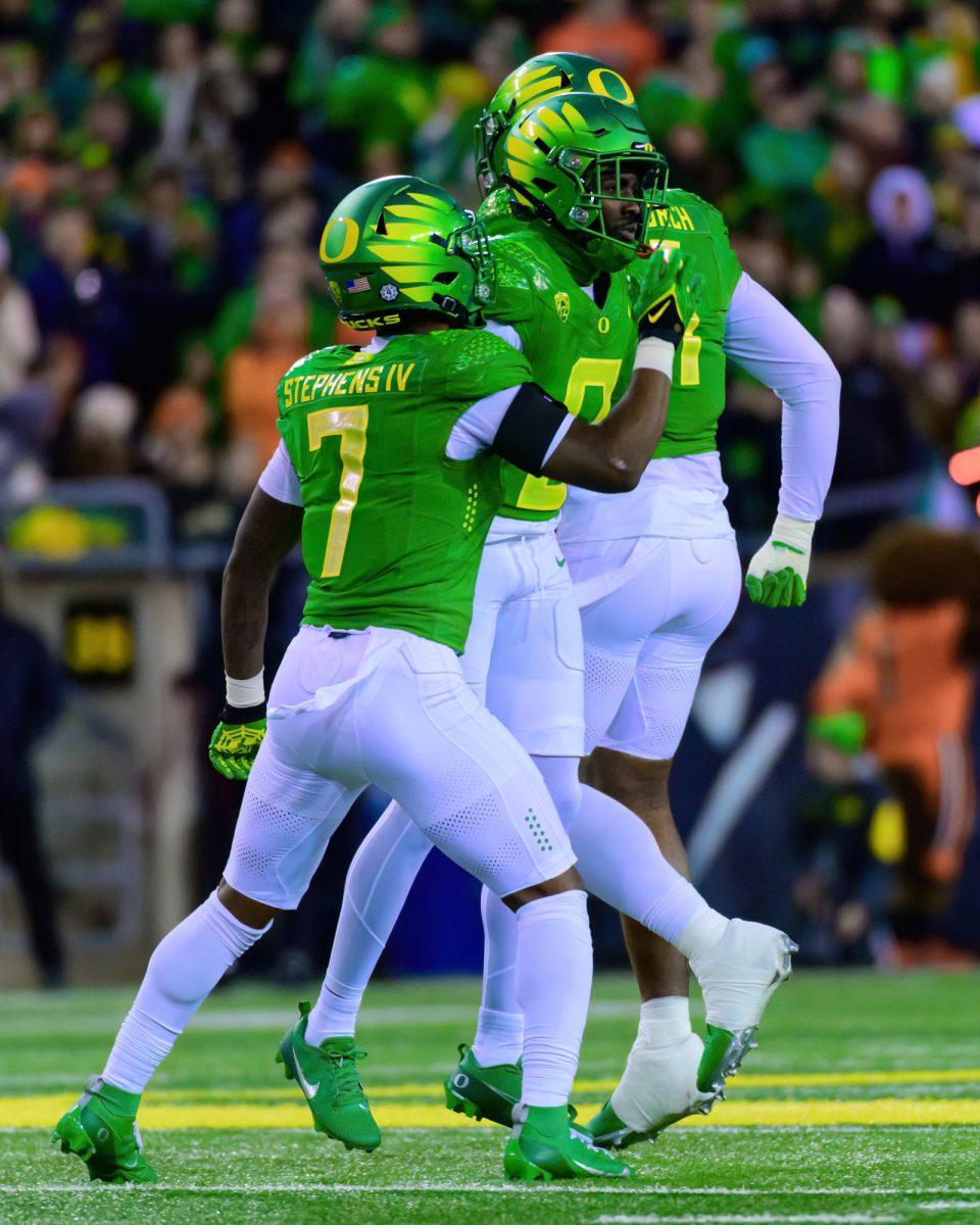 Oregon DB Dontae Manning (8) celebrates with Steve Stephens IV (7) after breaking up a pass. The University of Oregon Ducks Football team defeated Oregon State University 31-7 in a home match at Autzen Stadium in Eugene, Ore., on Nov. 24, 2023. (Eric Becker/Emerald)