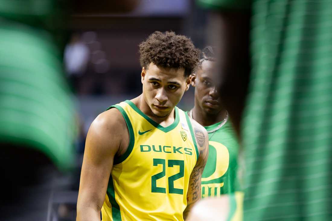 Jadrian Tracey (22) listens to Head Coach Dana Altman during a Ducks timeout. The University of Oregon Ducks Men&#8217;s Basketball team defeated the Tennessee State Tigers 92-67 at Matthew Knight Arena in Eugene, Ore., on Nov. 17, 2023. (Kemper Flood/ Emerald)