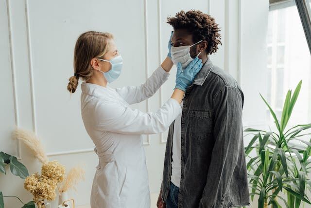 https://www.pexels.com/photo/doctor-checking-up-a-man-5215020/