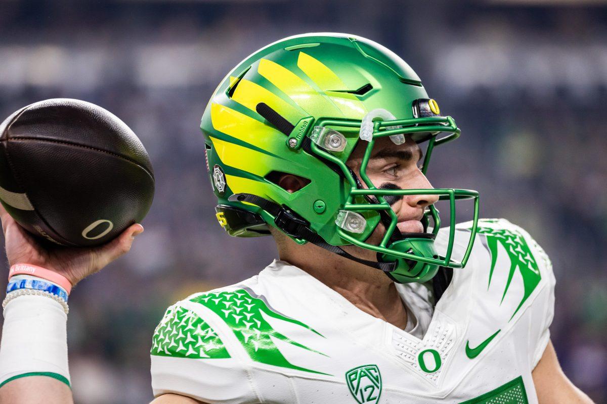 Bo Nix (10) uses a timeout to warm up his throwing arm as the Ducks prepare to hit the field and score a touchdown before the first half comes to an end.&#160;The Washington Huskies defeat the Oregon Ducks football team in the Pac-12 Championship at Allegiant Stadium in Las Vegas on Dec. 1, 2023. (Jonathan Suni/Emerald)