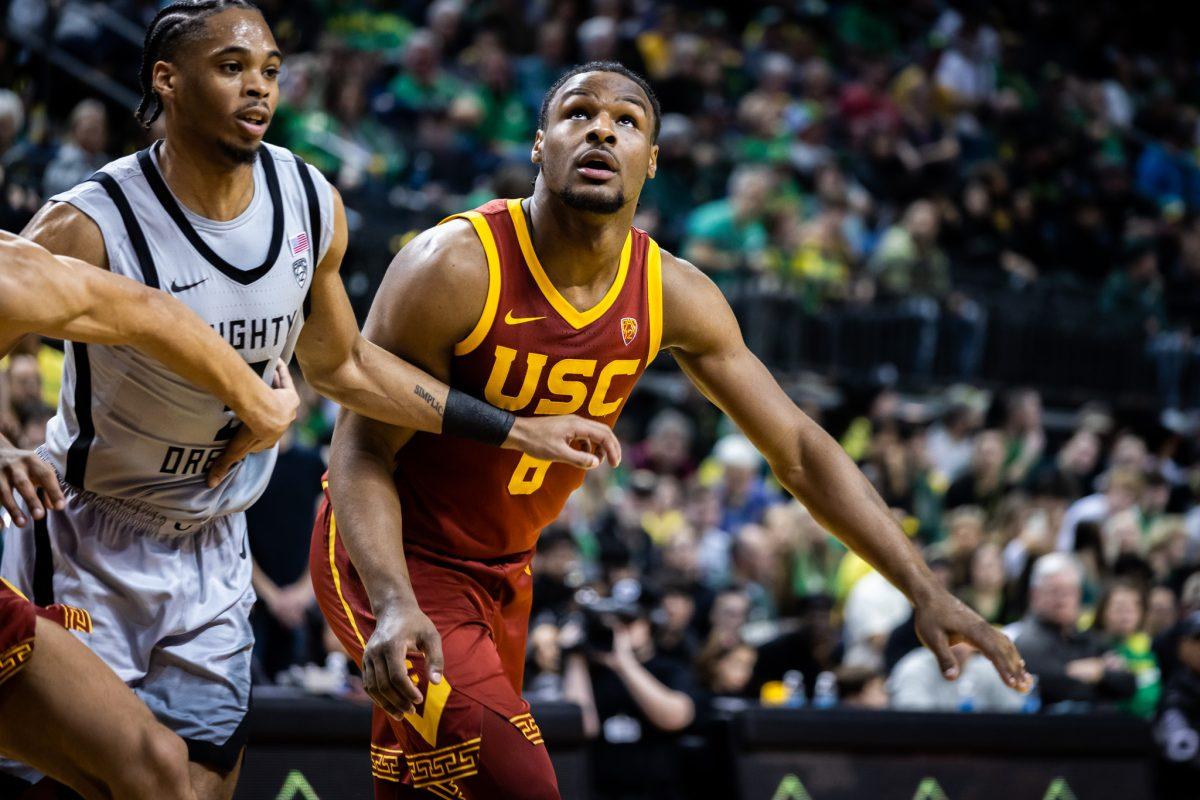 Bronny James (6) looks to get the potential rebound off an Oregon free throw.&#160;The Oregon Men's Basketball Team host the USC Trojans to start their last season of conference play in the PAC-12 &#160;at Matthew Knight Arena in Eugene, Ore., on Dec. 28, 2023. (Jonathan Suni/Emerald)