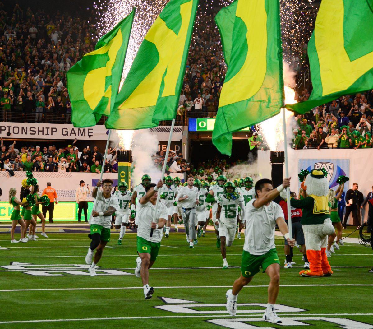 Oregon head coach Dan Lanning leads the Ducks out in the Pac-12 Championship. The Washington Huskies defeat the Oregon Ducks football team in the Pac-12 Championship at Allegiant Stadium in Las Vegas on Dec. 1, 2023. (Kai Kanzer/Emerald)