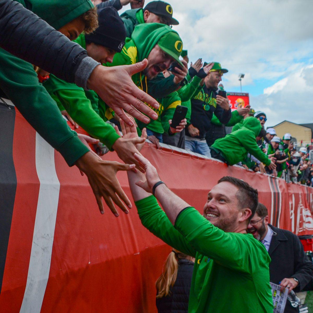 Oregon Head Coach, Dan Lanning celebrates with Duck fans after beating the University of Utah 35-6 at Rice-Eccles Stadium in Salt Lake City, Utah. The No. 8 Oregon Ducks defeat the No. 12 Utah Utes 35-6 at Rice-Eccles Stadium in Salt Lake City, Utah, on Oct. 28, 2023. (Kai Kanzer/Emerald)