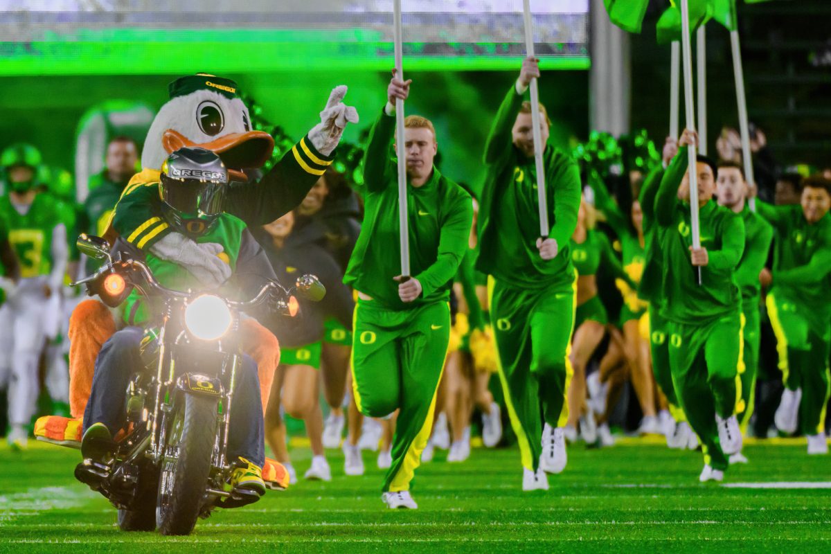 The Oregon Duck leads the team onto the field. The University of Oregon Ducks Football team defeated Oregon State University 31-7 in a home match at Autzen Stadium in Eugene, Ore., on Nov. 24, 2023. (Eric Becker/Emerald)