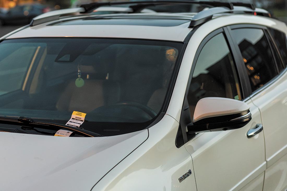 An SUV with a parking citation sits in the B-East parking lot on the University of Oregon campus. (Eliott Coda/Emerald)&#160;