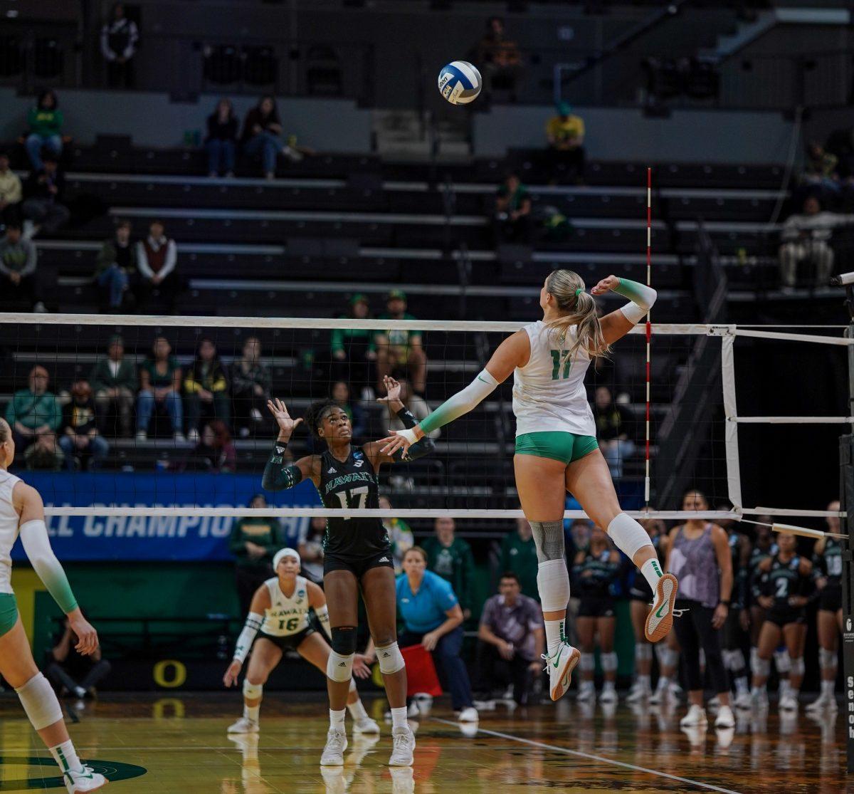 <p>Morgan Lewis (11) goes up and crushes the ball. Oregon Volleyball take on the University of Hawaii at Matthew Knight Arena in Eugene, Ore. on Dec 1, 2023. (Eddie Bruning/Emerald)</p>