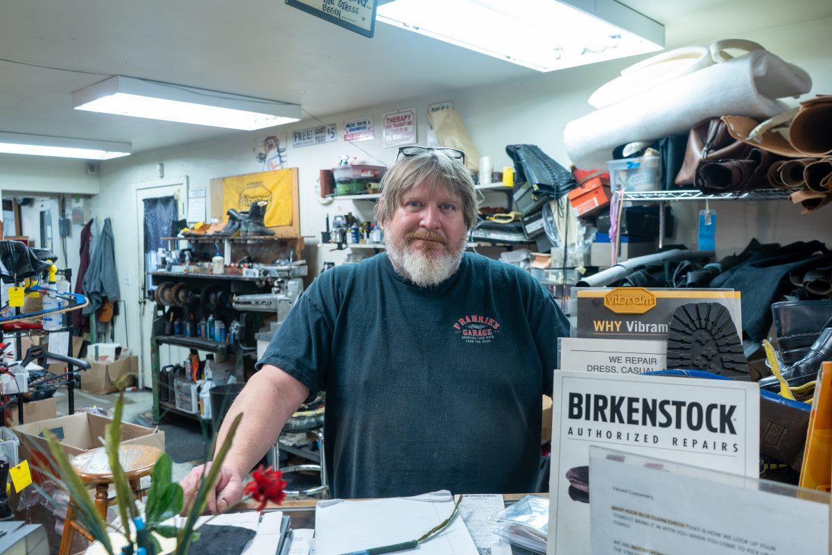 Jim the shoe doctor in Eugene, Ore., on Dec. 7, 2023. (Spencer So/Emerald)