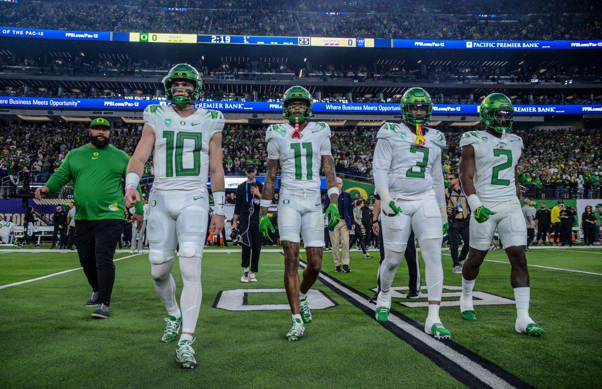 Oregon captains walk out to the coin toss pregame. The Washington Huskies defeat the Oregon Ducks football team in the Pac-12 Championship at Allegiant Stadium in Las Vegas on Dec. 1, 2023. (Kai Kanzer/Emerald)