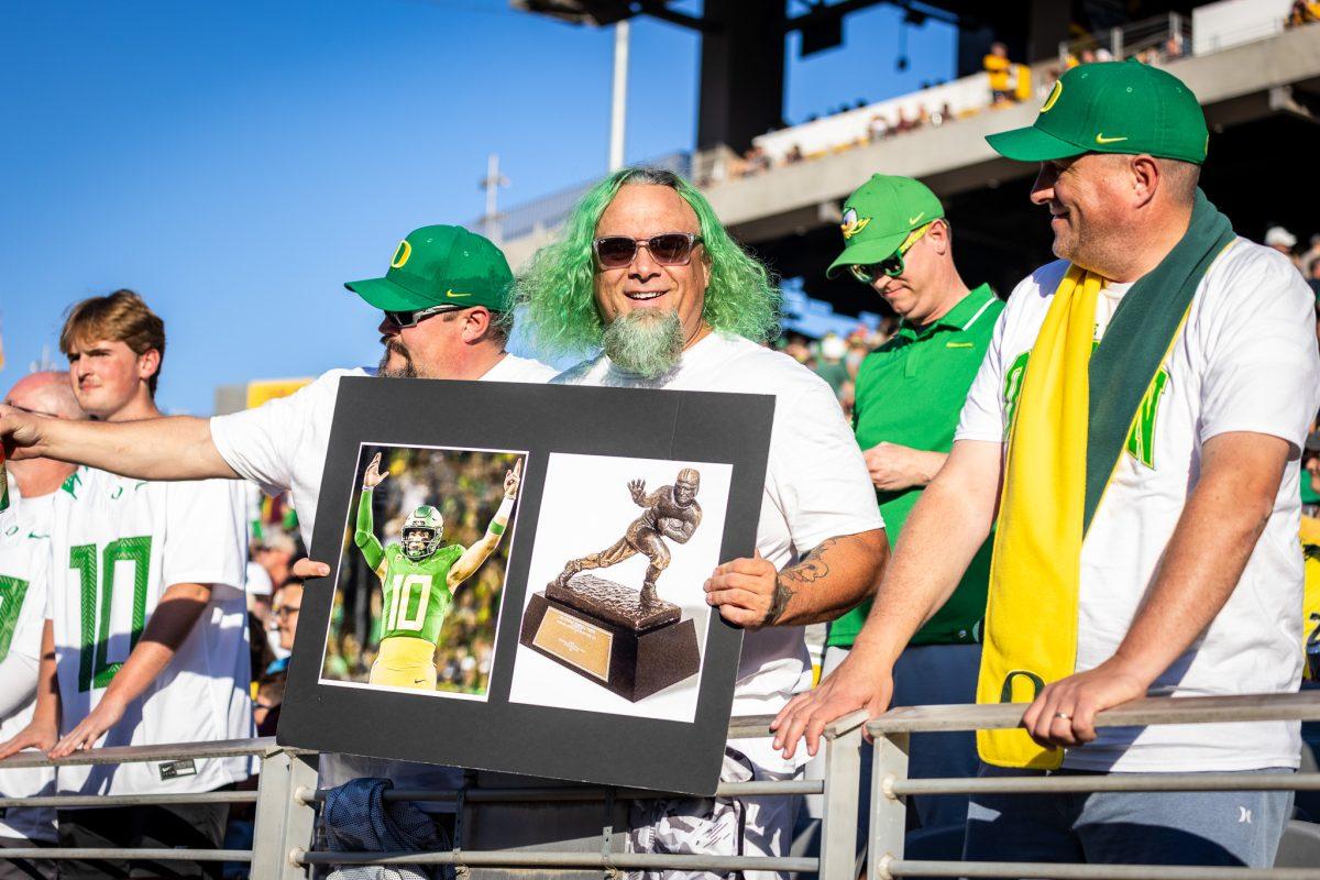 Oregon fans take turns chanting "Bo" and "Heisman" as this incredible display of offense only adds to his impressive resume on the season. The Oregon Ducks crush the Arizona State Sun Devils at Mountain America Stadium in Tempe, Ariz., on Nov. 18, 2023. (Jonathan Suni/Emerald)