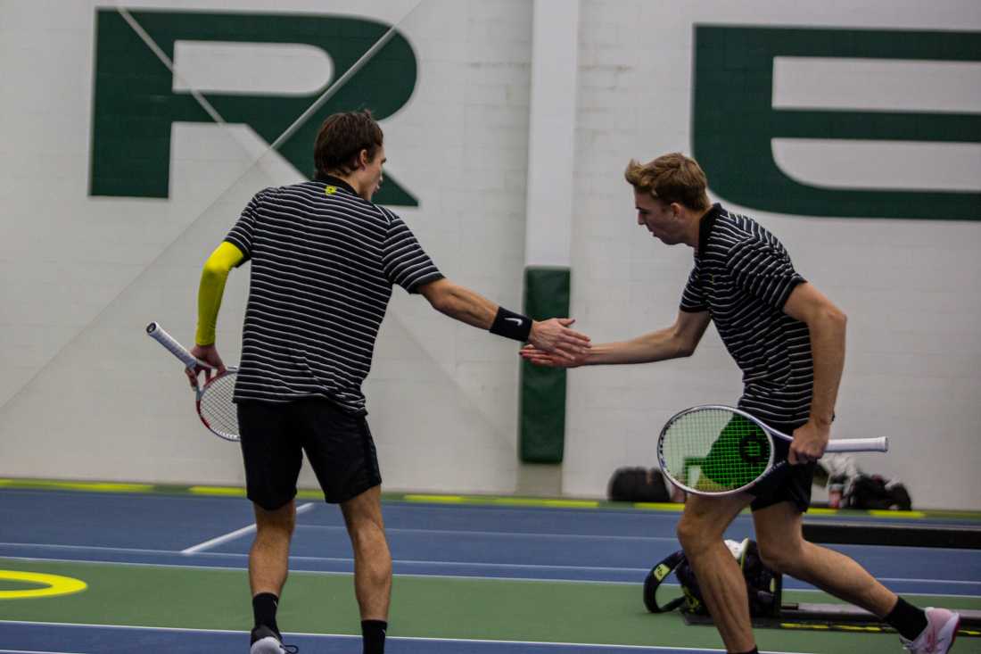 Doubles partners, Joshua Charlton (Right) and Quinn Vandecasteele (Left) celebrate together after winning the point. Oregon Men's Tennis face off against UC Riverside in Eugene, Oregon on January 20, 2023. (Kai Kanzer/Emerald)