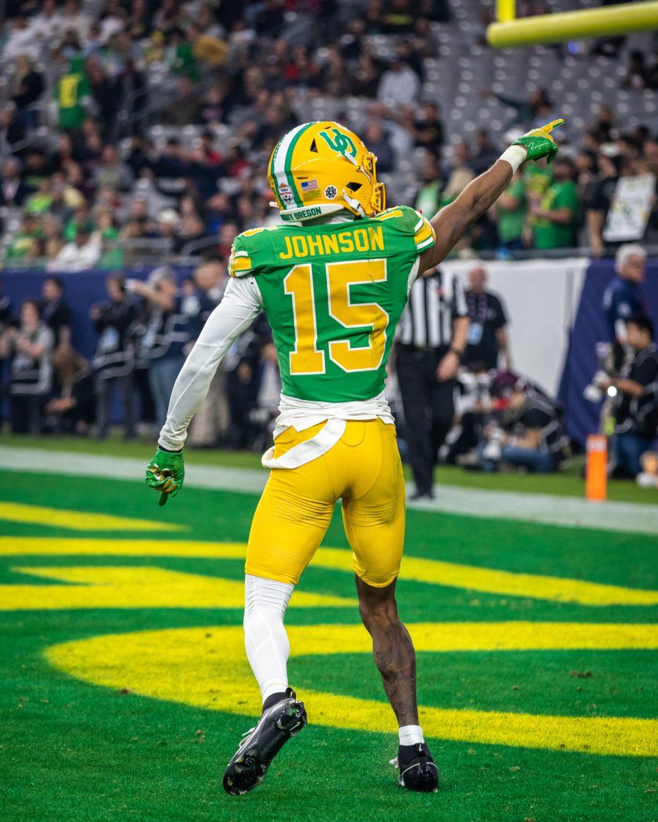 Tez Johnson (15) takes a moment to acknowledge the Oregon fans after scoring an electrifying touchdown to get the crowd going.&#160;The Oregon Ducks crush the Liberty Flames at State Farm Stadium in Glendale, Ariz., on Jan. 1, 2024. (Jonathan Suni/Emerald)