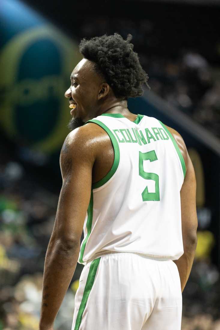 The Ducks call a timeout and Jermaine Couisnard (5) smiles at his teammates. The University of Oregon Men&#8217;s Basketball team beat the Arizona State Sun Devils 80-61 at Matthew Knight Arena in Eugene, Ore., on Jan. 25, 2024. (Kemper Flood/ Emerald)