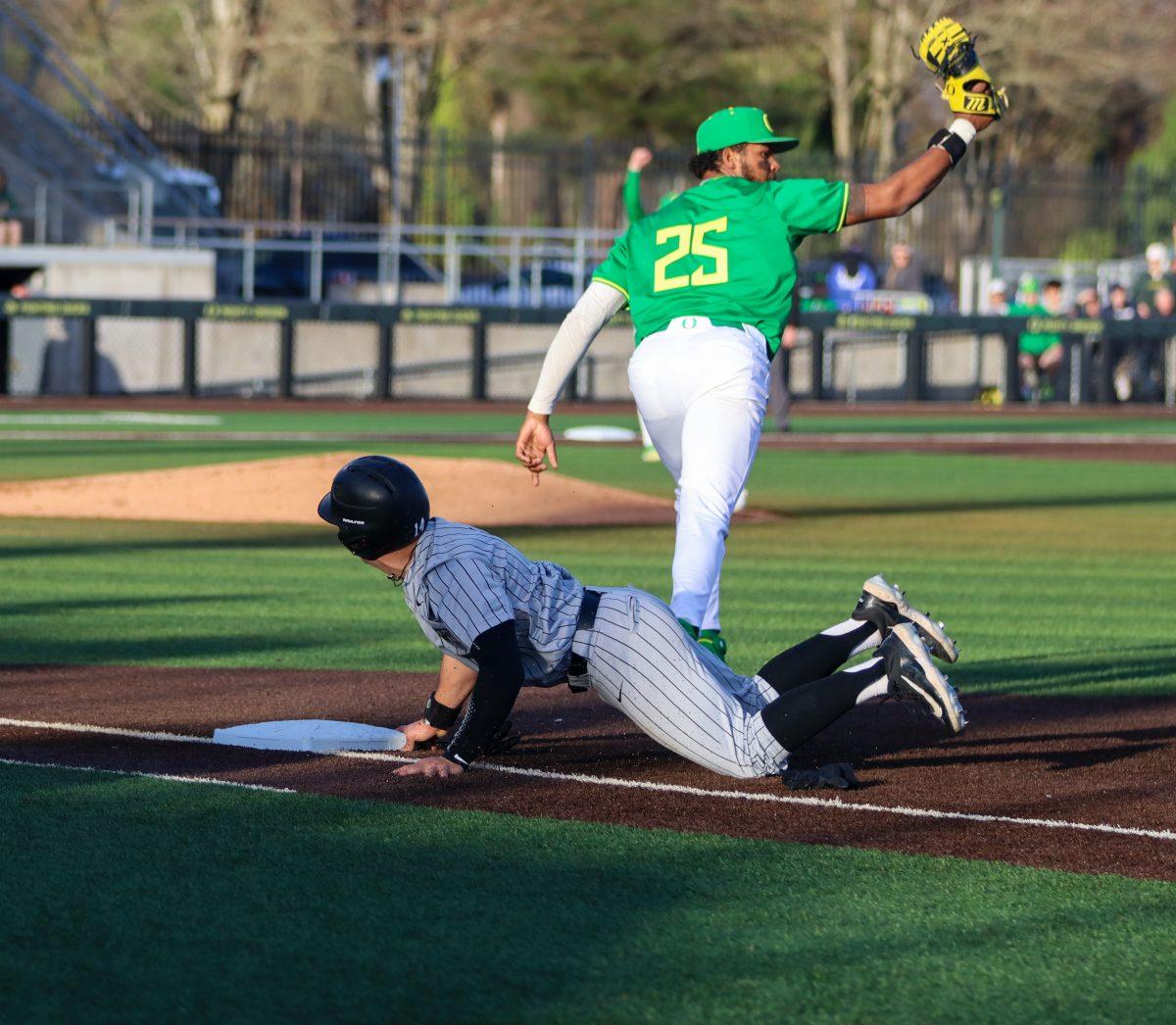 Jacob Walsh (25) running off 1st base after picking off Charlie Chropuvka (14). The Oregon Baseball team defeats Lafayette College 17-3 in Game 1 of the series at PK Park in Eugene, Ore., on Feb.23, 2024. (Alyssa Garcia/Emerald)