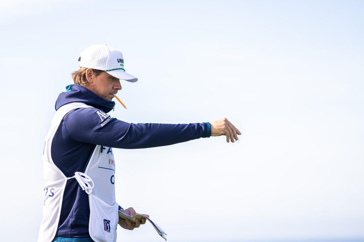 Finnish caddie, Valno Viitaharju, checks the direction and power of the sea side winds of Torrey Pines.&#160;The four day Farmers Insurance Open is held in San Diego, CA, from Jan. 24th to Jan. 27th, 2024. (Jonathan Suni/Emerald)