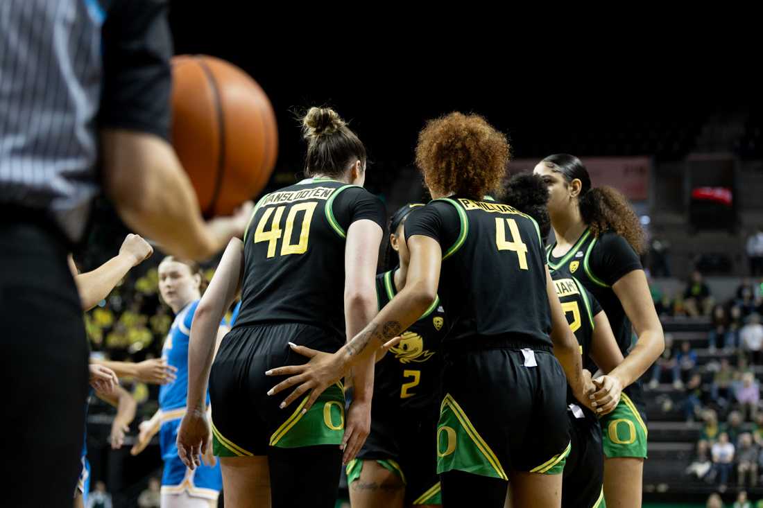 The team huddles together after a foul was called on the Ducks. The University of Oregon Women&#8217;s basketball team played the University of California, Los Angeles at Matthew Knight Arena in Eugene, Ore., on Feb.18, 2024. (Kemper Flood/ Emerald)