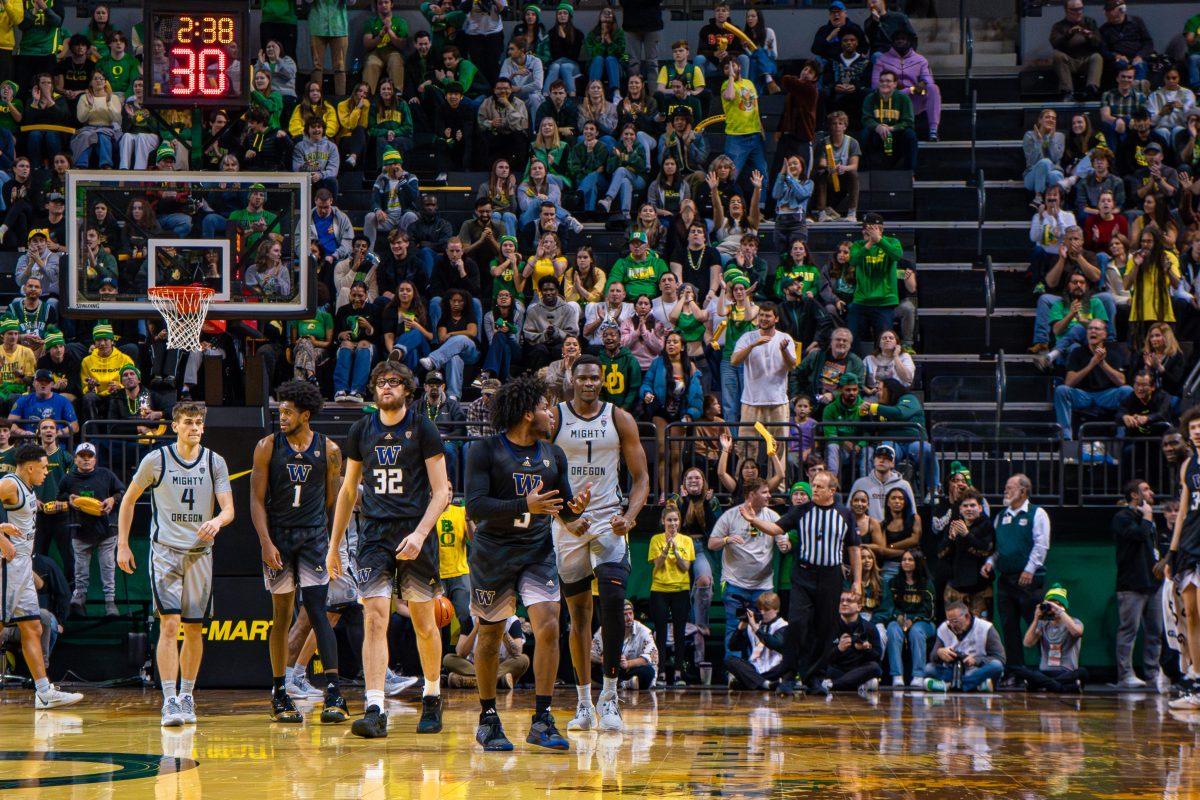 N'Faly Dante (1) flexes. The University of Oregon Ducks Men&#8217;s Basketball Team played the University of Washington Huskies in a home match at Matthew Knight Arena in Eugene, Ore., on Feb. 8, 2024. (Spencer So/Emerald)