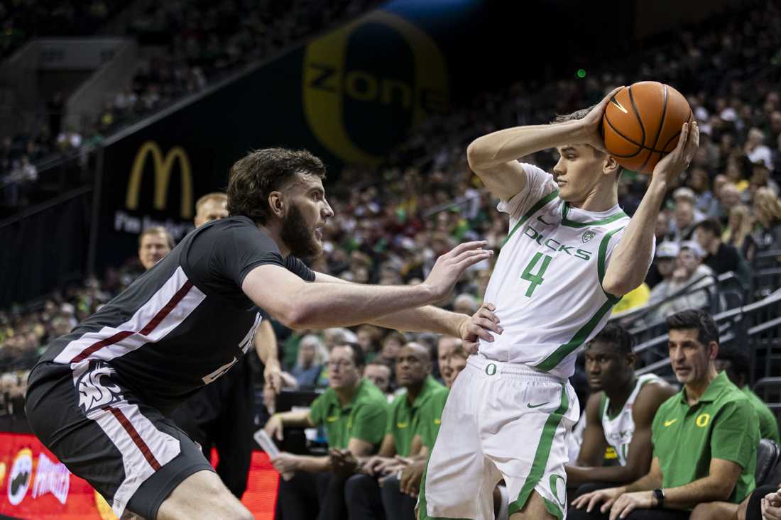 Oregon guard Brennan Rigsby looks for an opening while being defended by Washington State center Oscar Cluff. After a fast-paced second half, the Oregon Men's Basketball team lost 62-56 to the Washington State University Cougars in Matthew Knight Arena on Feb. 10, 2024. (Alex Hernandez/Emerald)