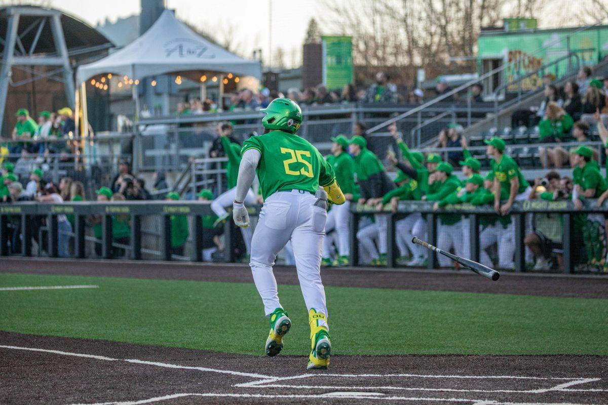 Jacob Walsh (25) and the Oregon bench admire a homerun hit to right- center. Walsh flips his bat and watched his first homerun of the 2024 season.&#160; The Oregon Baseball team defeats Lafayette College 17-3 in Game 1 of the series at PK Park in Eugene, Ore., on Feb.23, 2024. (Kai Kanzer/Emerald)