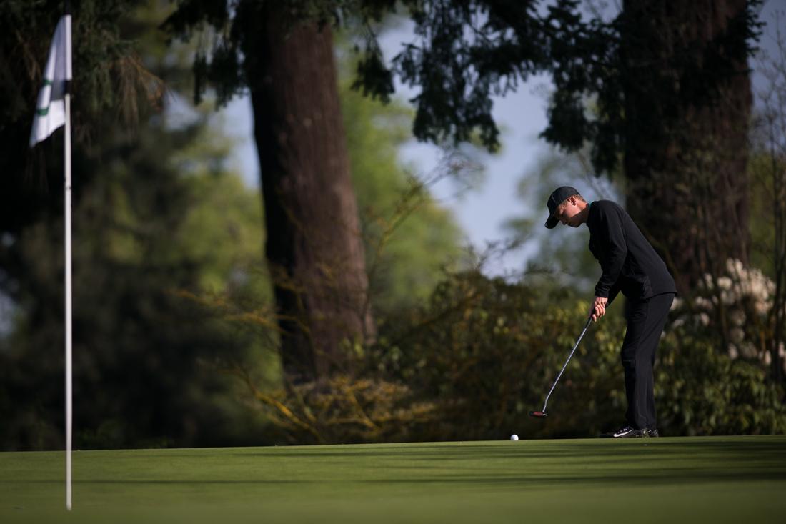 Freshman Craig Ronne puts the ball. Oregon Ducks men's golf plays in the Pac-12 Championships at Eugene Country Club in Eugene, Ore. on April 22, 2019. (Ben Green/Emerald)