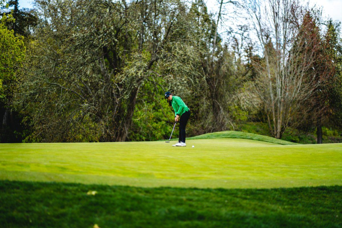 A golfer for the University of Oregon narrowly misses a putt.&#160;The Eugene Country Club hosted the Pac-12 women's golf championships from April 18-20, 2022. (Will Geschke/Emerald)