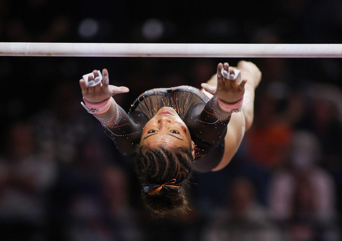 Natalie Briones, a Sophmore for Oregon State, does a clear hip with flight backwards to high bar, which is considered a D-value transfer move. Natalie Briones would go on to earn a score of 9.850, tying her at 5th place. Oregon State Gymnastics take on the University of Washington at Gill Coliseum in Corvallis, on March 8, 2024. (Eddie Bruning/Emerald)