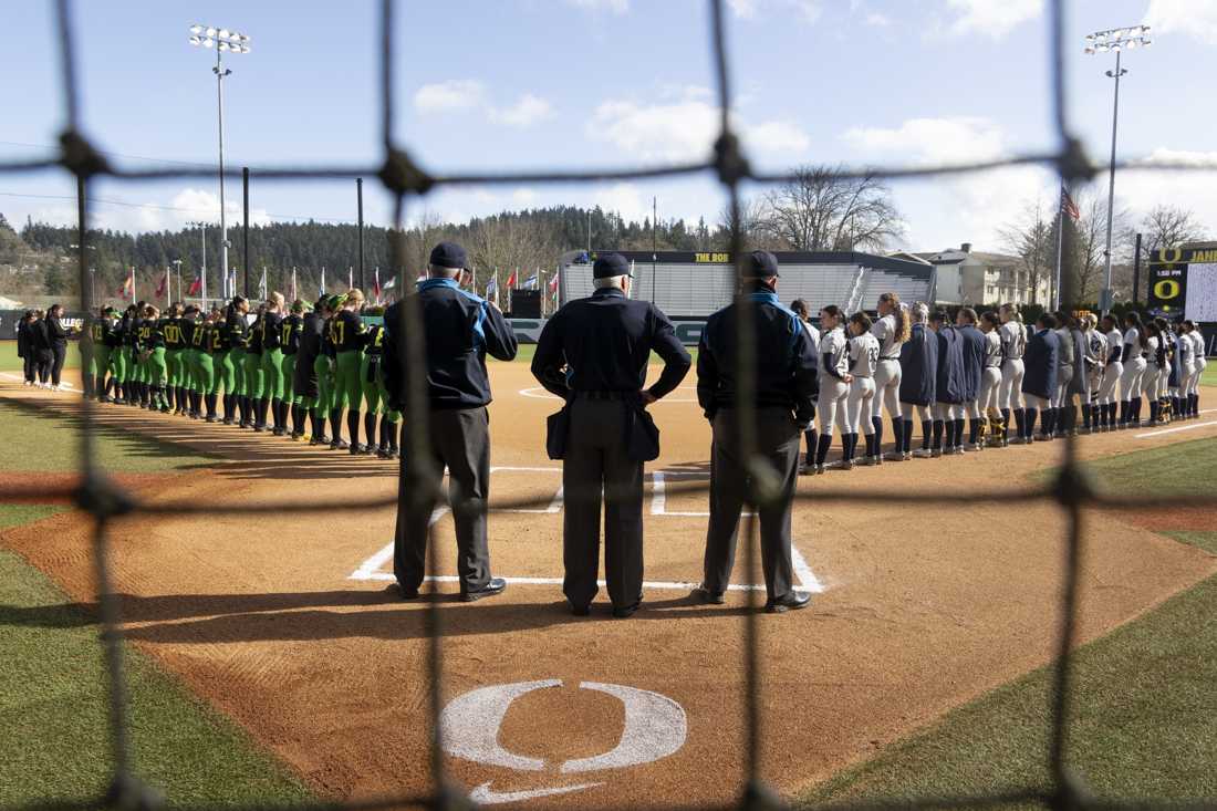 <p>The teams and umpires line up for the national anthem at the beginning of the game. The Oregon women's softball team took a 5-2 win as they faced off against the University of California, Berkeley's Golden Bears at Jane Saunders Stadium on March 9, 2024. (Alex Hernandez/Emerald)</p>