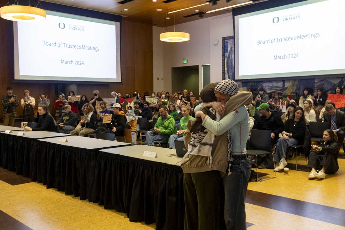 Iman Zarlons (left) hugs Salem Khoury (right) after speaking to the UO Board of Trustees during the meeting on March 12, 2024. People gathered outside of the Ford Alumni Center for a rally before the University of Oregon Board of Trustees meeting, where some spoke during the public comments section alongside other students and community members, with topics ranging from proposed "Boycott, Divest, Sanction" strategies, to Jewish students feeling unsafe due to protests and demonstrations on campus. (Alex Hernandez/Emerald)