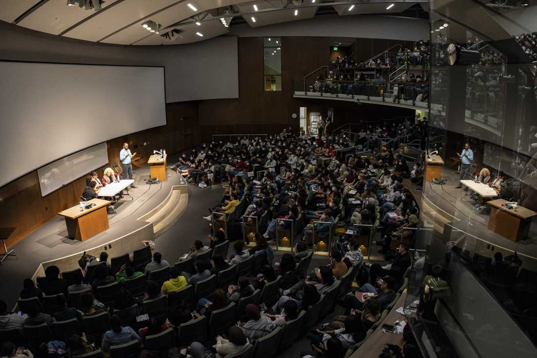 Angela Davis answers questions from a panel and speaks to a packed lecture hall on March 6, 2024. Hundreds of people gathered in Straub 156 to hear Angela Davis speak "on apartheid, prisons, and capitalism" at an event organized in collaboration with the UO's Multicultural Center and ROAR Center. The lecture hall has an official capacity of 520, which overfilled within minutes of the doors opening, leaving would-be listeners&#8212;some of whom traveled hours to attend the event&#8212;to find other ways to see and hear Davis' talk. (Alex Hernandez/Emerald)