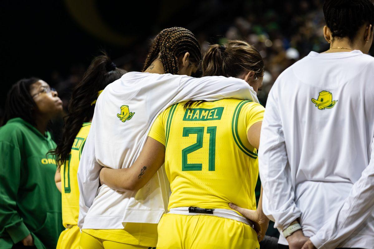 Priscilla Williams (4) hugs Oregon senior, Bella Hamel (21), during a time out.&#160;The Oregon&#160;Women's&#160;Basketball team host #4 Stanford at Matthew Knight Arena in Eugene, Ore., on March 2, 2024. (Jonathan Suni/Emerald)