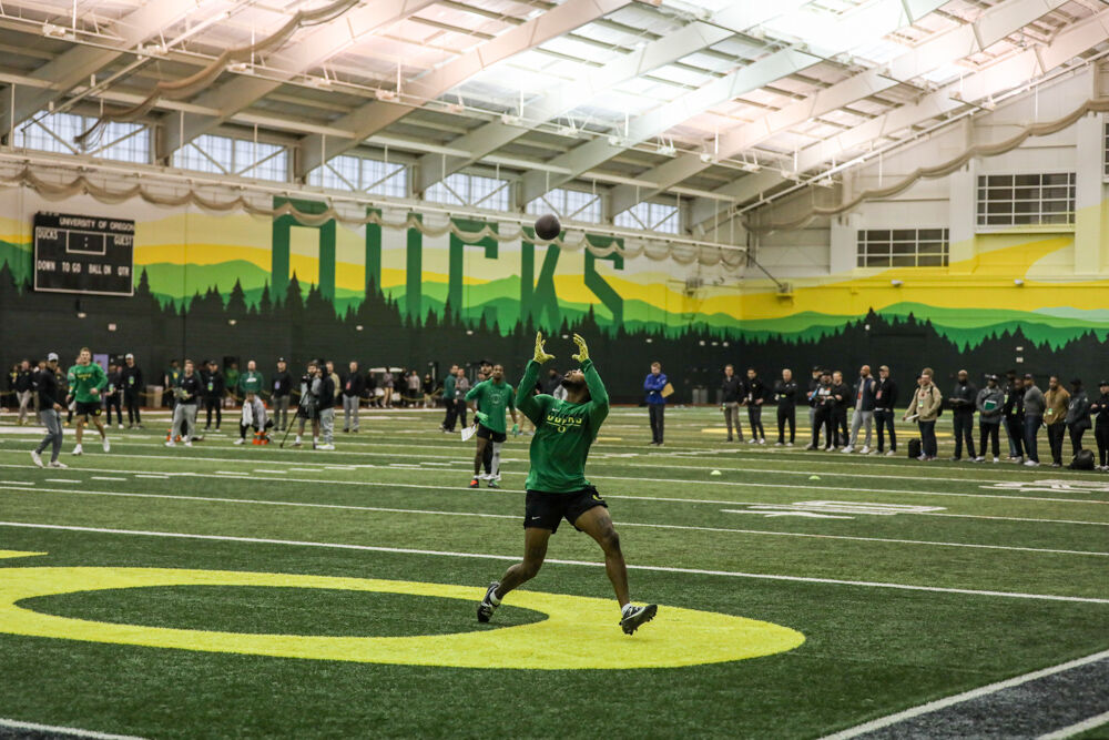 Troy Franklin makes a great catch over his head. Oregon Ducks prepare for the NFL Draft at their Pro Day 2024. (Kai Kanzer/Emerald)