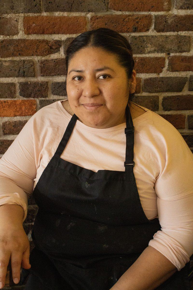 Owner of Peek-A-Boo Delight ice cream shop, Alma Vasquez sits down for a portrait. (Alyssa Garcia/Emerald)