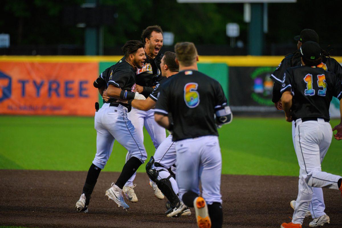 Victor Bericoto (left) celebrates with teammates after hitting a walk off RBI. The Eugene Emeralds beat the Vancouver Canadians by a final score of 2-1 at P.K. Park in Eugene, Oregon, on June 22, 2023. (Eric Becker/Emerald)