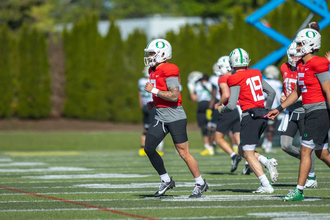 Quarterback Dillon Gabriel (08) runs between the fields following the completion of a drill. The Oregon Ducks football team takes the field at the Hatfield-Dowlin Complex on a cool Thursday morning for a practice in Eugene, Ore on April 18, 2023. (Molly McPherson/Emerald)