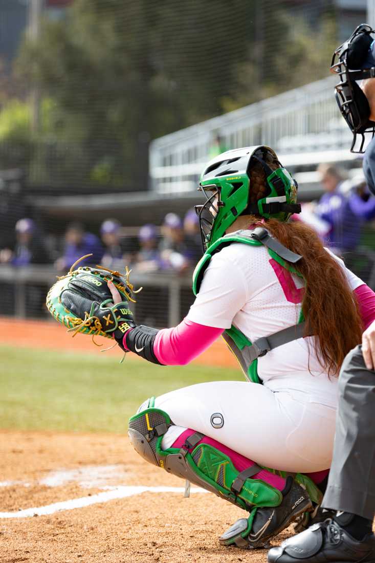 Vallery Wong (99) catches for the Ducks in the final series game against the Huskies. The University of Oregon Softball team defeated University of Washington 6-4 in a Pac-12 series at Jane Sanders Stadium in Eugene, Ore., on April 7, 2024. (Kemper Flood/Emerald)