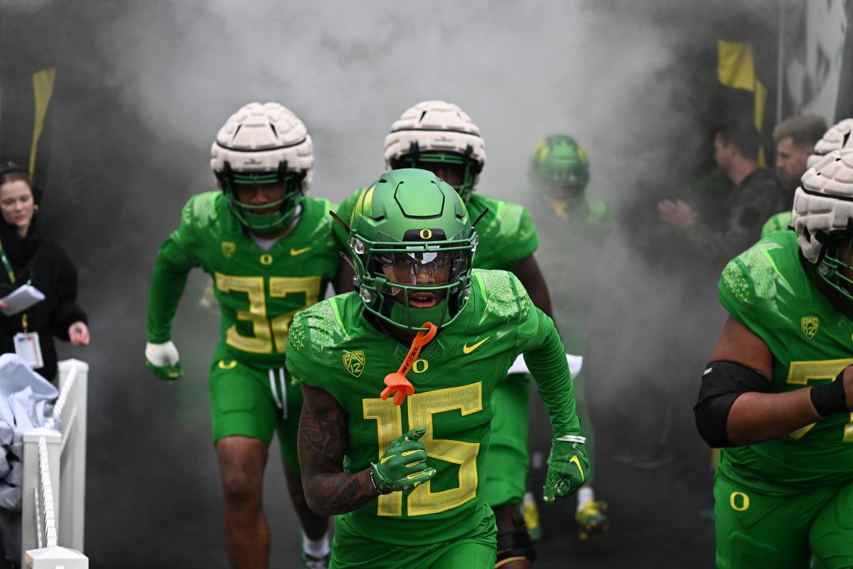 Wide Recevier Tez Johnson (15) runs out of the tunnel as a part of the "Green Team" during the Oregon Ducks 2024 Spring Game. Johnson enters the season as one of the highest rated Receivers on the nation.&#160;The "Green Team" wins 28-17 during the Oregon Ducks Spring Game in Autzen Stadium on April 27, 2024. (Kai Kanzer/Emerald)