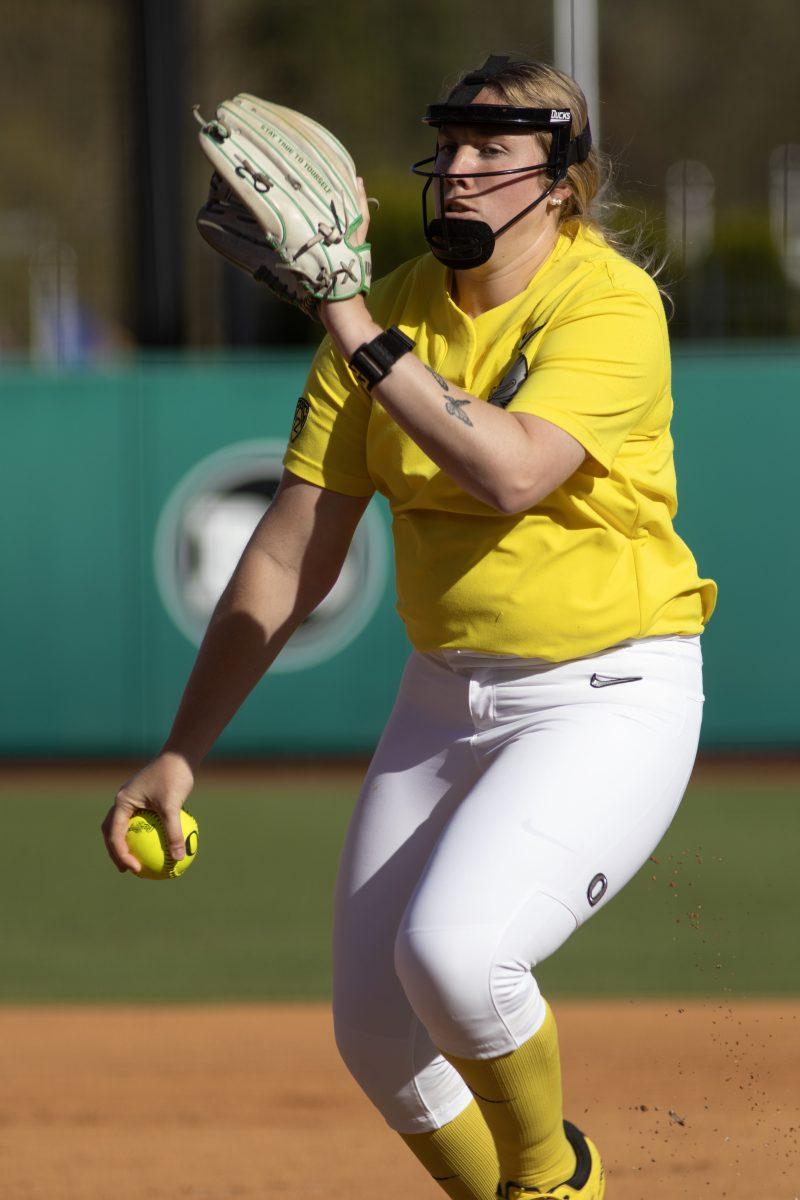 Morgan Scott (23) prepares to deliver a pitch. The Oregon Softball team secures the win 11-3 over Oregon State in game 1 of their Rivalry Series, hosted at Jane Sanders Stadium in Eugene, Ore., on April 19, 2024. (Alyssa Garcia/Emerald)