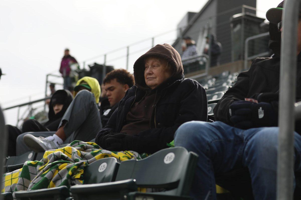 A fan watches as Oregon goes down 5-1. UC Santa Barbara defeats the Oregon Baseball team 7-3 in Game 2 of the series at PK Park in Eugene, Ore., on March 2, 2024. (Kai Kanzer/Emerald)